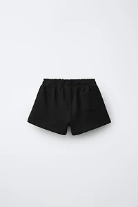 RUBBERIZED APPLIQUÉ PLUSH SHORTS