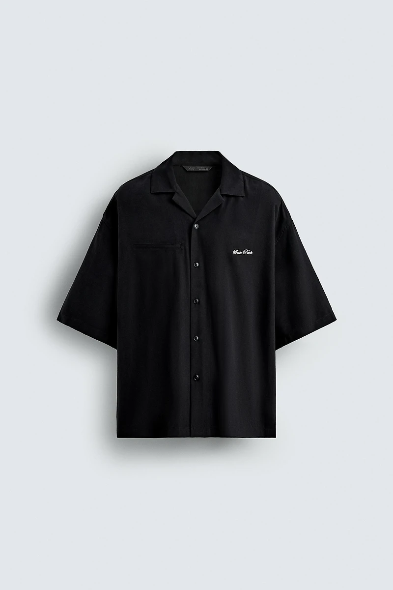 FLOWY SHIRT WITH EMBROIDERED TEXT
