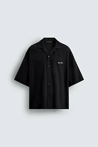 FLOWY SHIRT WITH EMBROIDERED TEXT