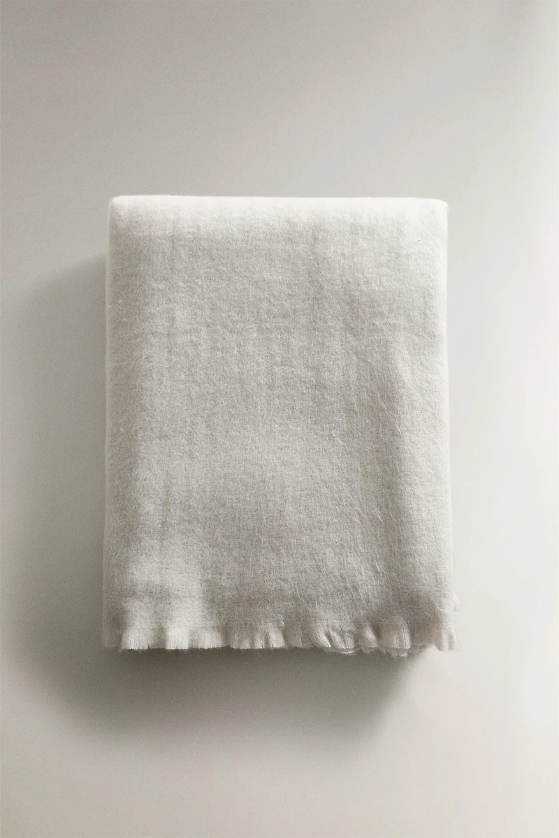 PLAID DOUX À FRANGES