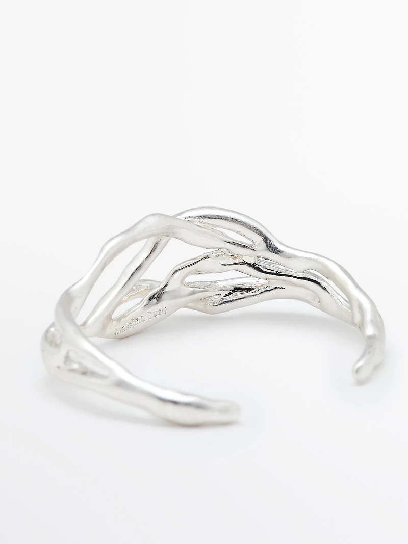 Bracelet métallique abstrait