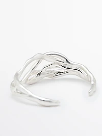 Bracelet métallique abstrait