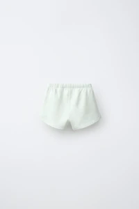 TERRY SHORTS WITH CHICK APPLIQUÉ