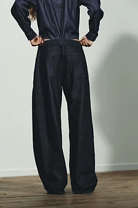 PLEATED FAUX DENIM PANTS