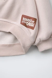 REINDEER FAUX SHEARLING PATCH SWEATSHIRT