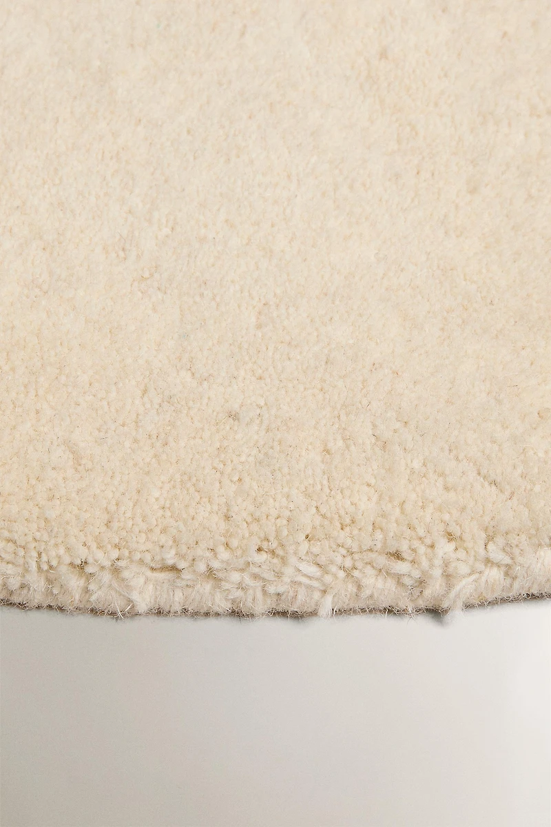 PLAIN IRREGULAR WOOL AREA RUG