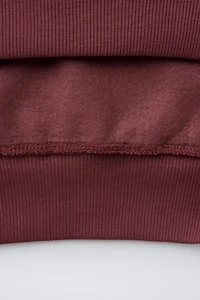 SWEAT À CAPUCHE INSCRIPTION BRODÉE