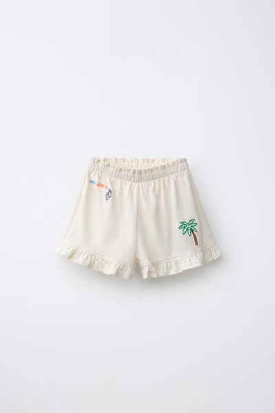 TROPICAL PRINT RUFFLE HEM SHORTS