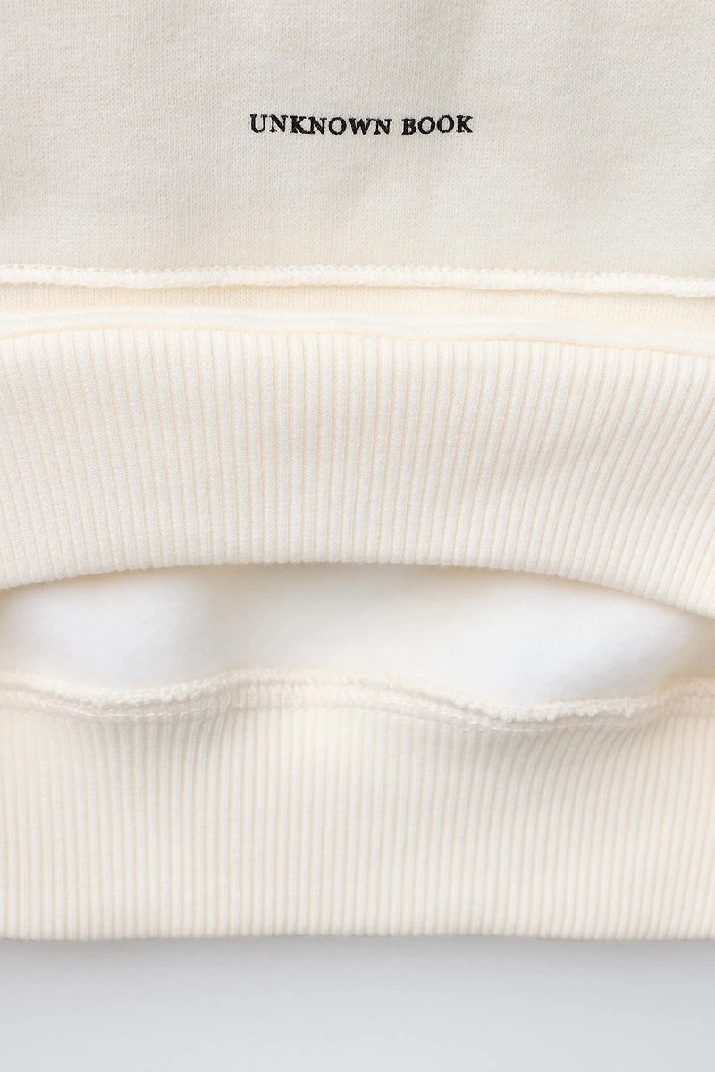PATCH AND FLOCKED TEXT SWEATSHIRT