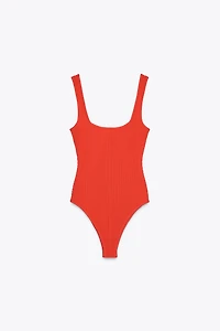 TEXTURED STRAPPY BODYSUIT