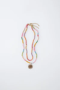 PACK OF TWO BEADED SUN NECKLACES