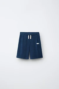 ENSEMBLE POLO ET BERMUDA EFFET ÉPONGE