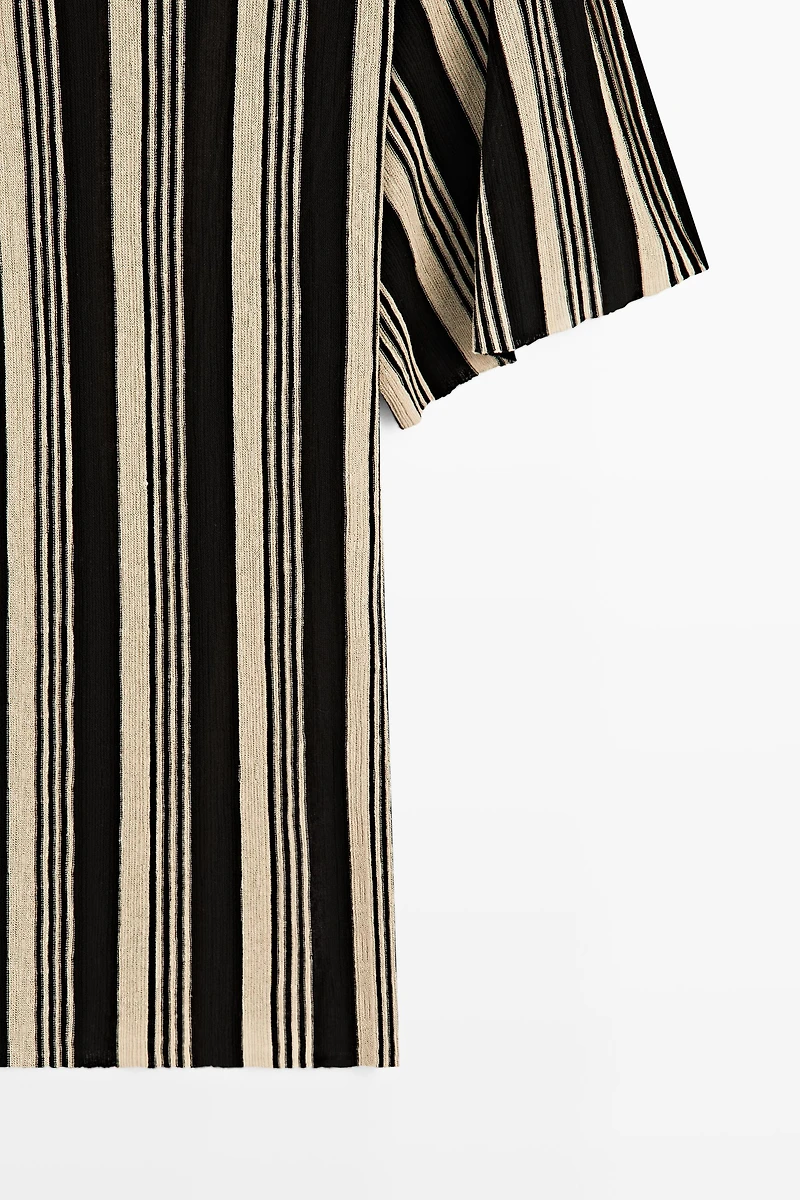 Pull en maille style tunique rayé