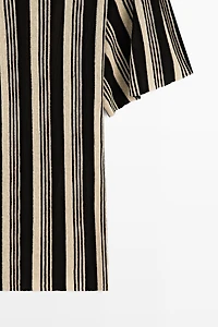 Pull en maille style tunique rayé