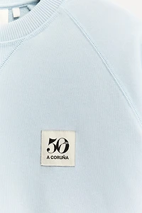 50TH ANNIVERSARY PATCH CREW NECK SWEATSHIRT