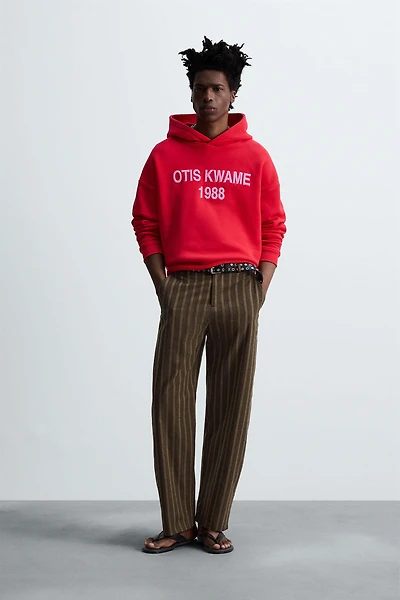 EMBROIDERED HOODIE SWEATSHIRT © OTIS KWAME KYE QUAICOE