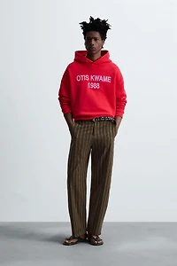 EMBROIDERED HOODIE SWEATSHIRT © OTIS KWAME KYE QUAICOE