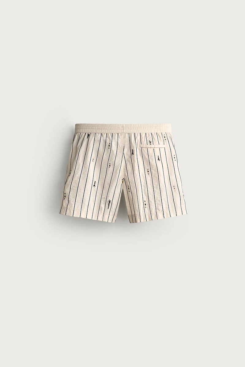 MAILLOT DE BAIN MI-LONG À RAYURES ET BRODERIES NAGEURS