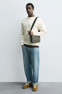 TEXTURED RUBBERIZED CROSSBODY BAG