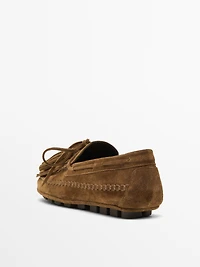 Split suede loafers with fringing and tassels
