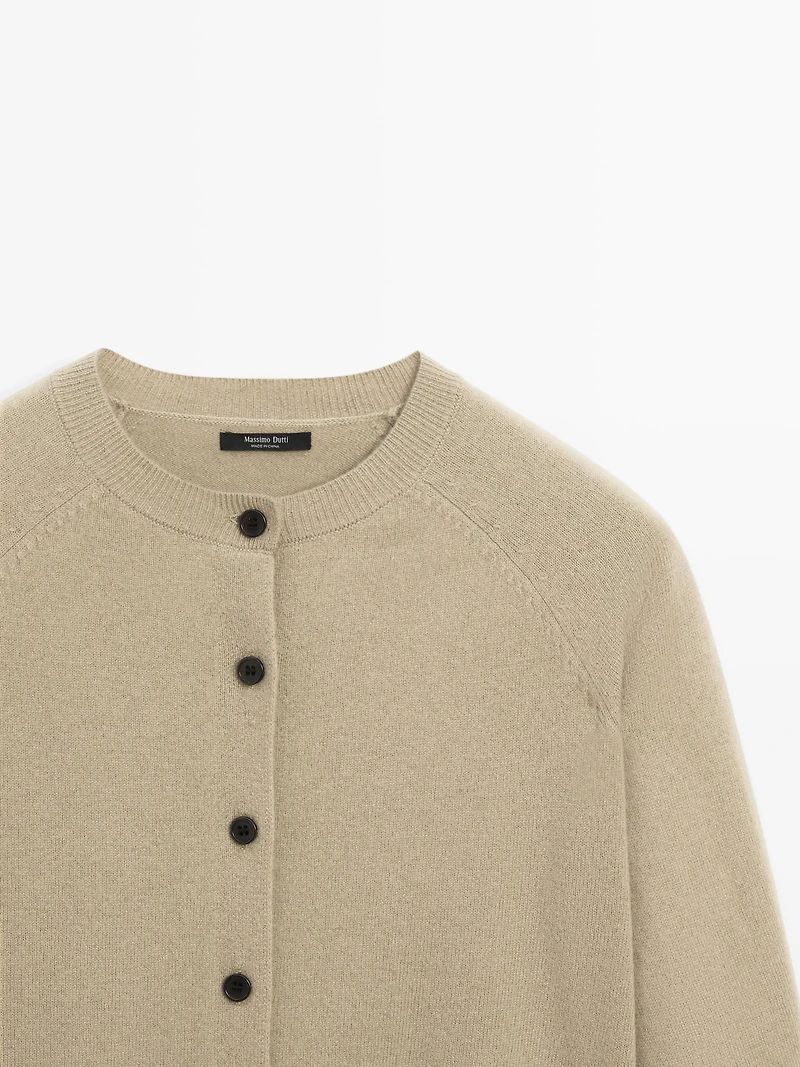 Short knit cardigan with raglan sleeves