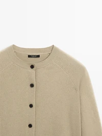 Short knit cardigan with raglan sleeves