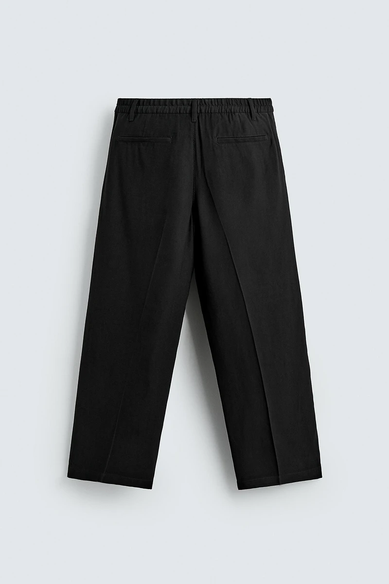 FLOWY RELAXED FIT PLEATED PANTS