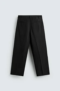 FLOWY RELAXED FIT PLEATED PANTS