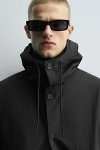 HOODED TECHNICAL JACKET