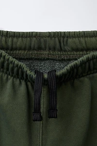 PANTALON EN MOLLETON LARGE CARGO TEINT PIÈCE