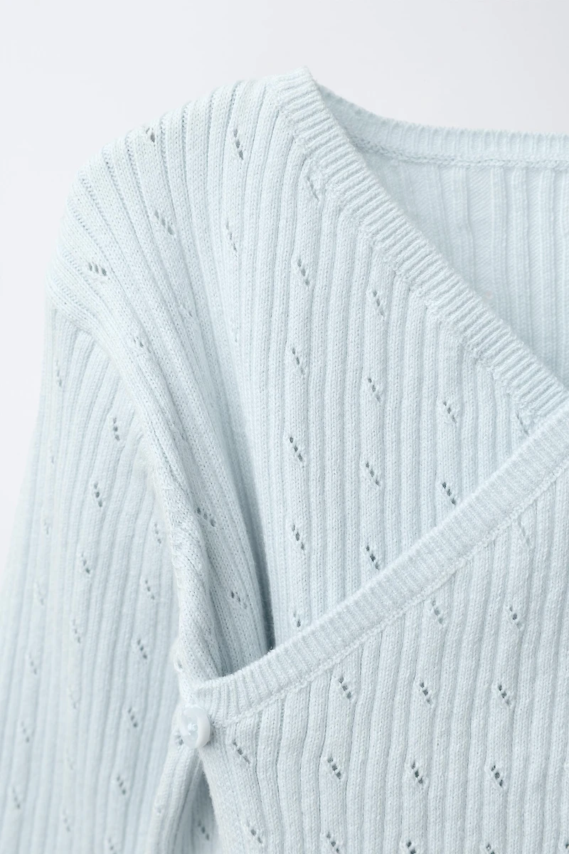 PULL EN MAILLE CÔTELÉ AJOURÉ