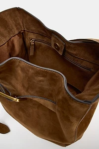LEATHER BUCKET BAG WITH BELT DETAIL