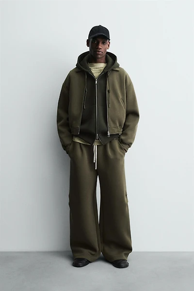 WIDE FIT NEOPRENE EFFECT PANTS WITH STUDS