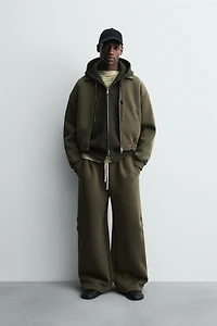 WIDE FIT NEOPRENE EFFECT PANTS WITH STUDS