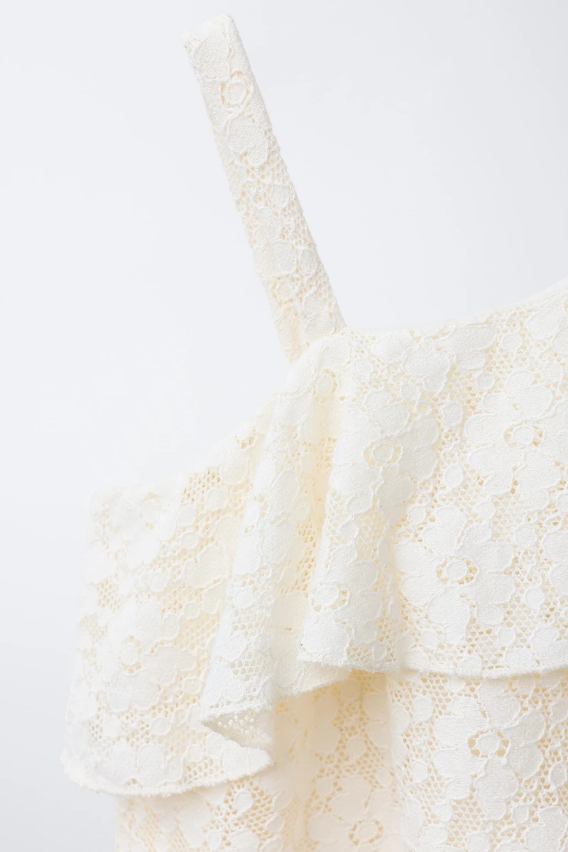 TOP ASYMÉTRIQUE VOLANT DENTELLE