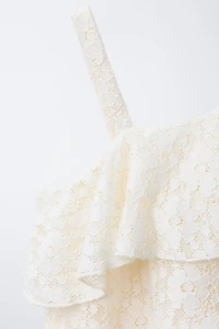 TOP ASYMÉTRIQUE VOLANT DENTELLE
