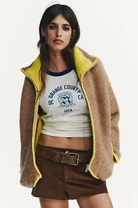 GILET EN MAILLE À FINITIONS CONTRASTANTES