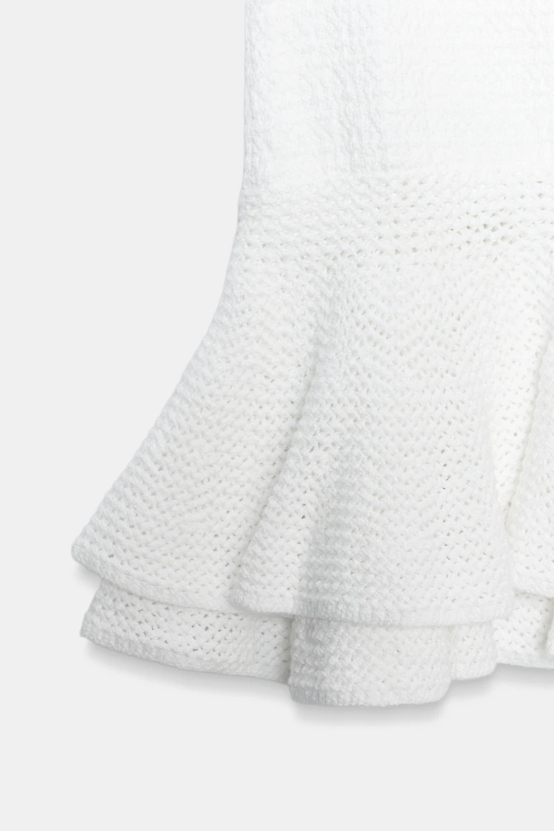 MINI JUPE EN MAILLE À VOLANTS