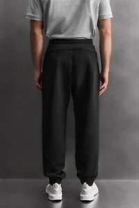 TECHNICAL PANTS WITH ZIPPERS