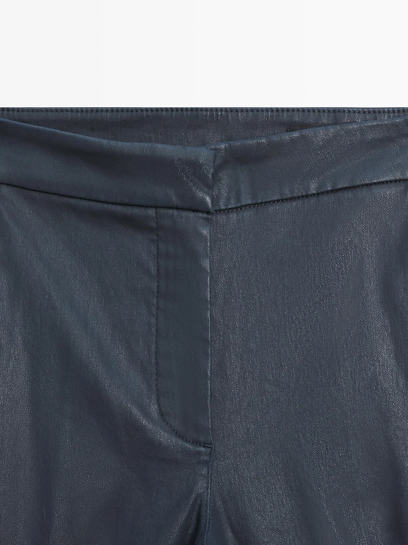 Waxed flare fit trousers