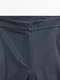 Waxed flare fit trousers