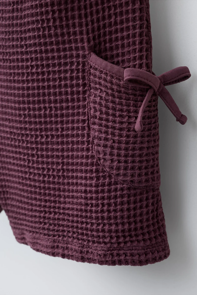 WAFFLE KNIT BOW ROMPER
