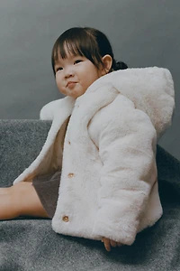 BLOUSON À CAPUCHE EFFET FOURRURE