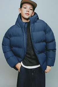 MANTEAU REMBOURRÉ ÉTIQUETTE DÉPERLANT