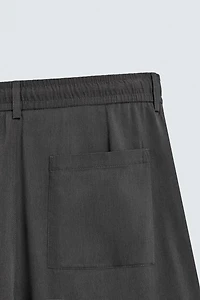 FLOWY PLEATED PANTS