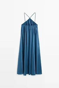 Long flowing dress with criss-cross straps