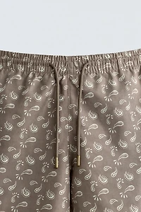 PAISLEY PRINT MID-LENGTH SWIM TRUNKS