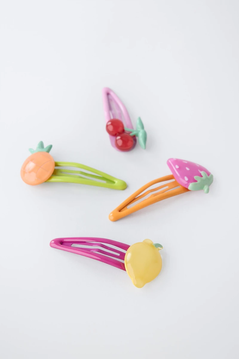 LOT DE QUATRE PINCES FRUITS