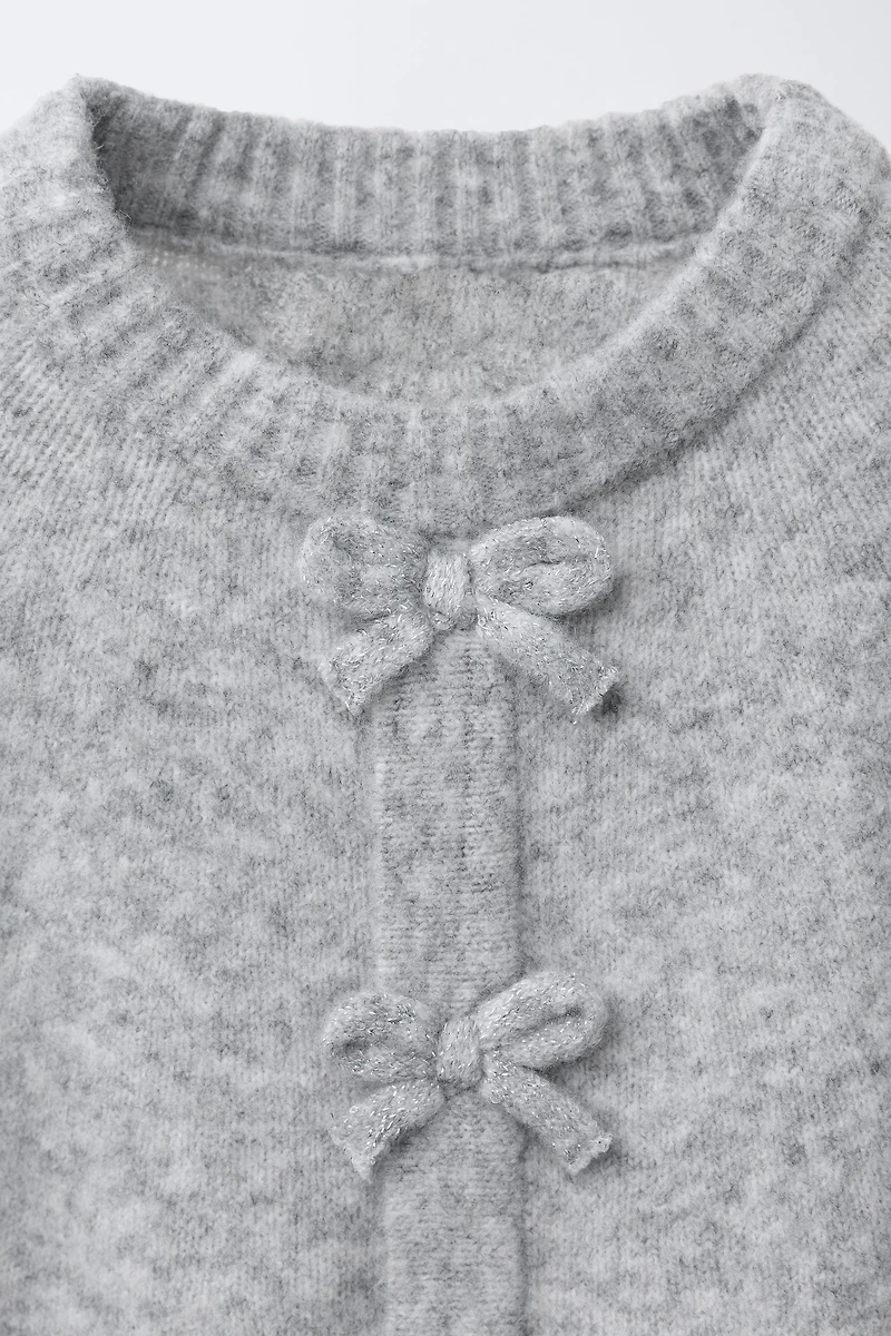 CAPE PONCHO WITH BOWS