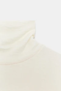 HAUT ASYMÉTRIQUE À COL ROULÉ